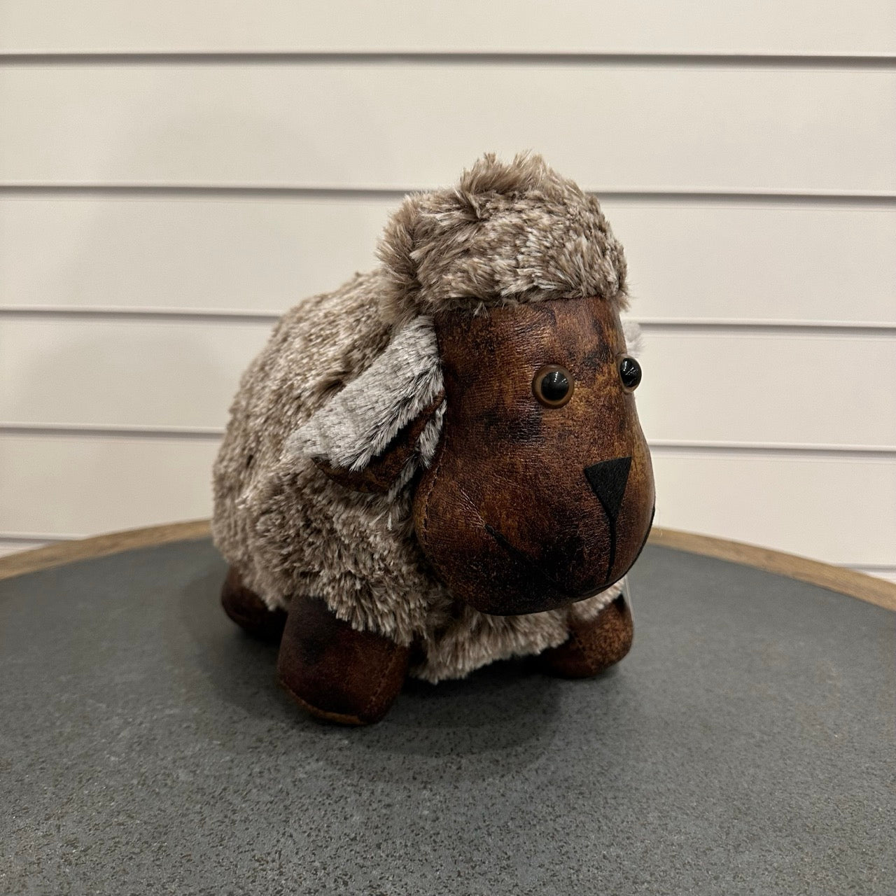 Brown and grey sheep door stop