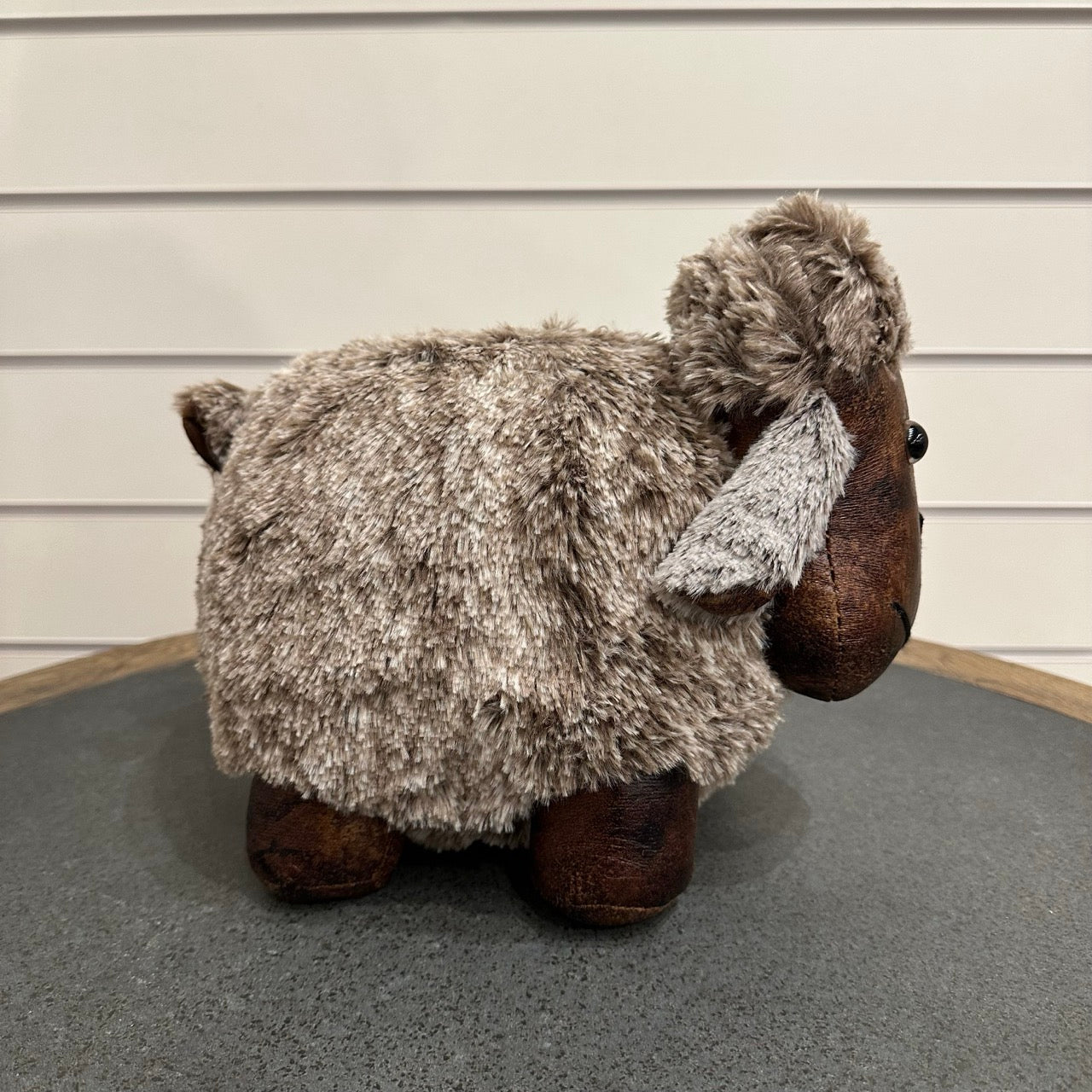 Brown and grey sheep door stop