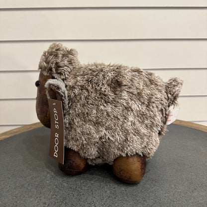 Brown and grey sheep door stop